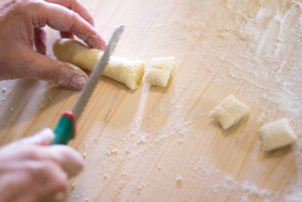Making Gnocchi: Hands Cutting Gnocchi Pieces